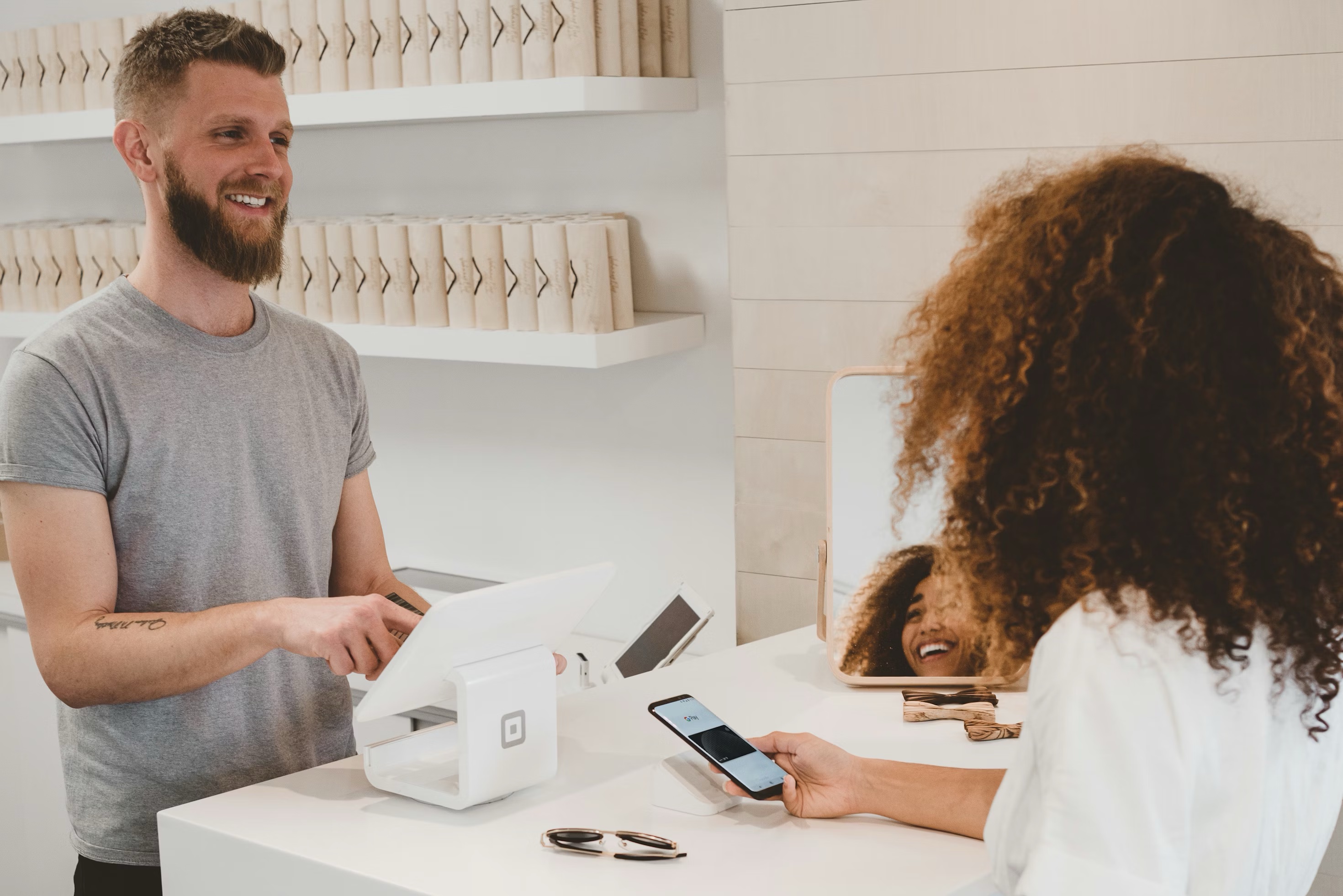 Local business owner helping a customer